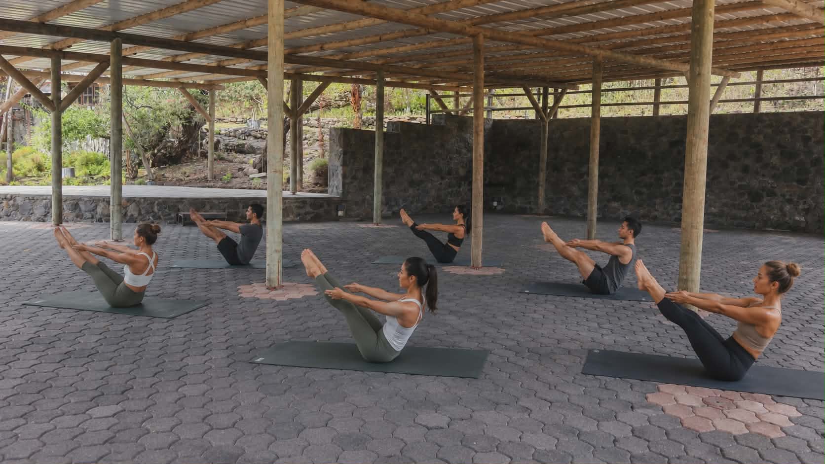 Pilates class under the open-air shelter on the Upper Deck